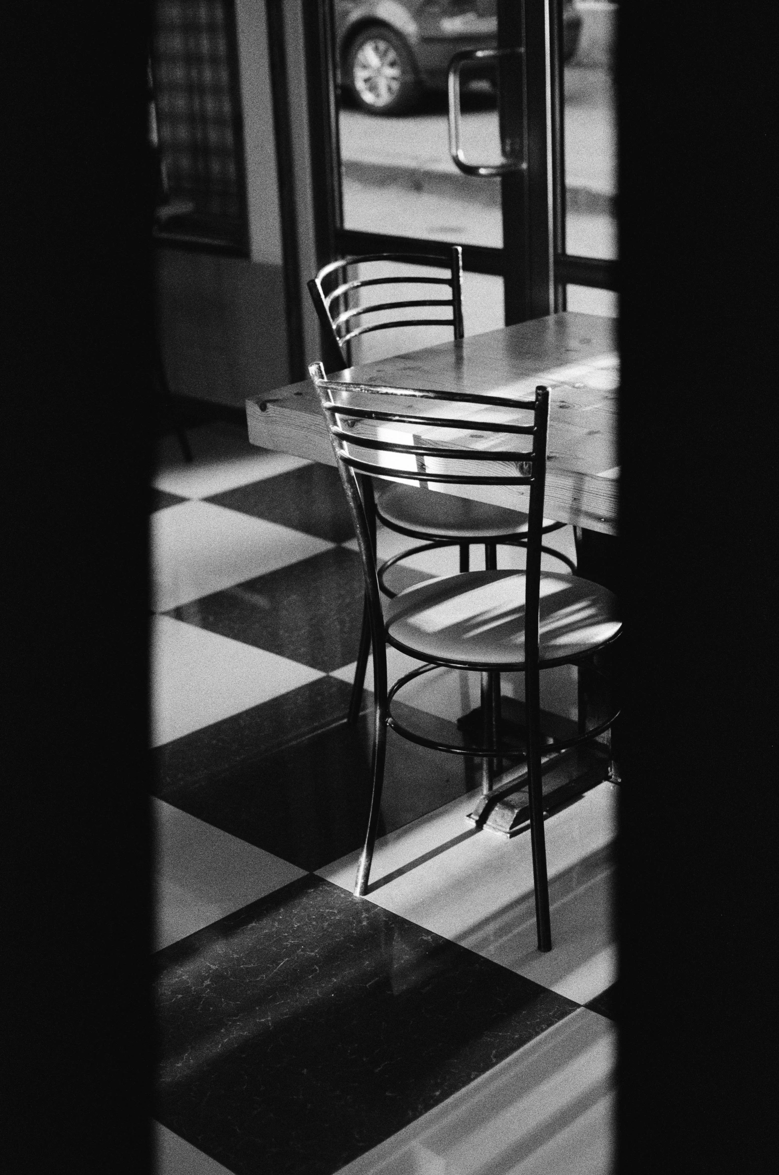 black and white pograph of table and chairs