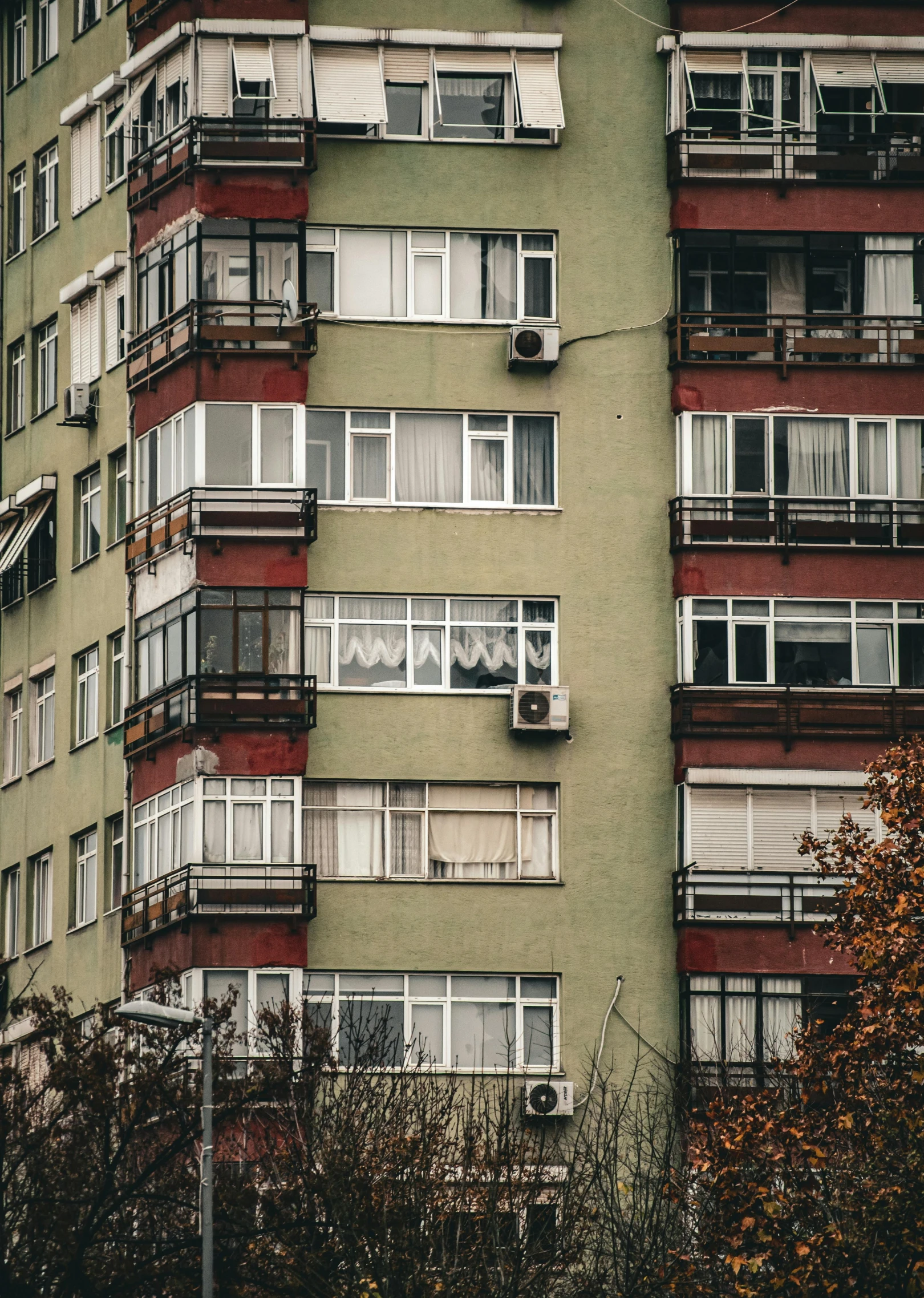 a very tall building with many balconies and windows