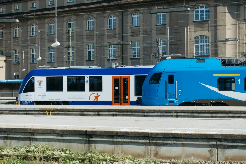 a couple of trains that are parked next to each other