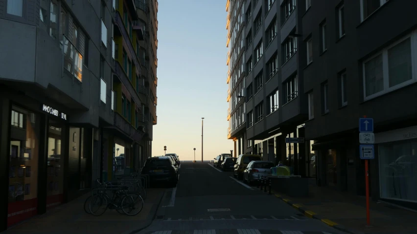 some tall buildings parked on the side of the street