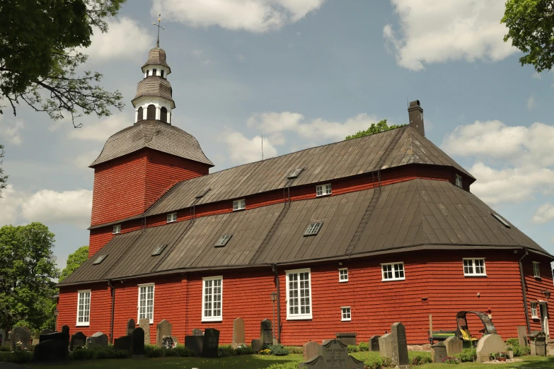 an old church with a steeple and two clocks