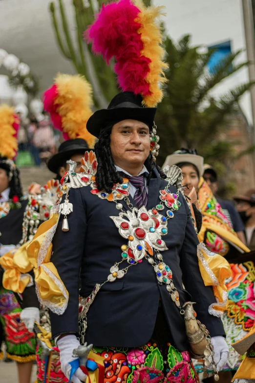 some people dressed in costumes and parade accessories