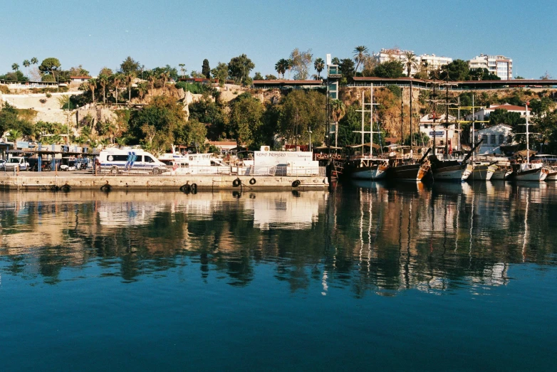 several boats are docked on the water