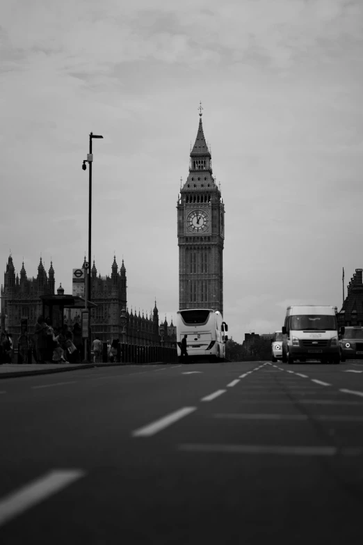 a bus parked in front of the big ben clock tower