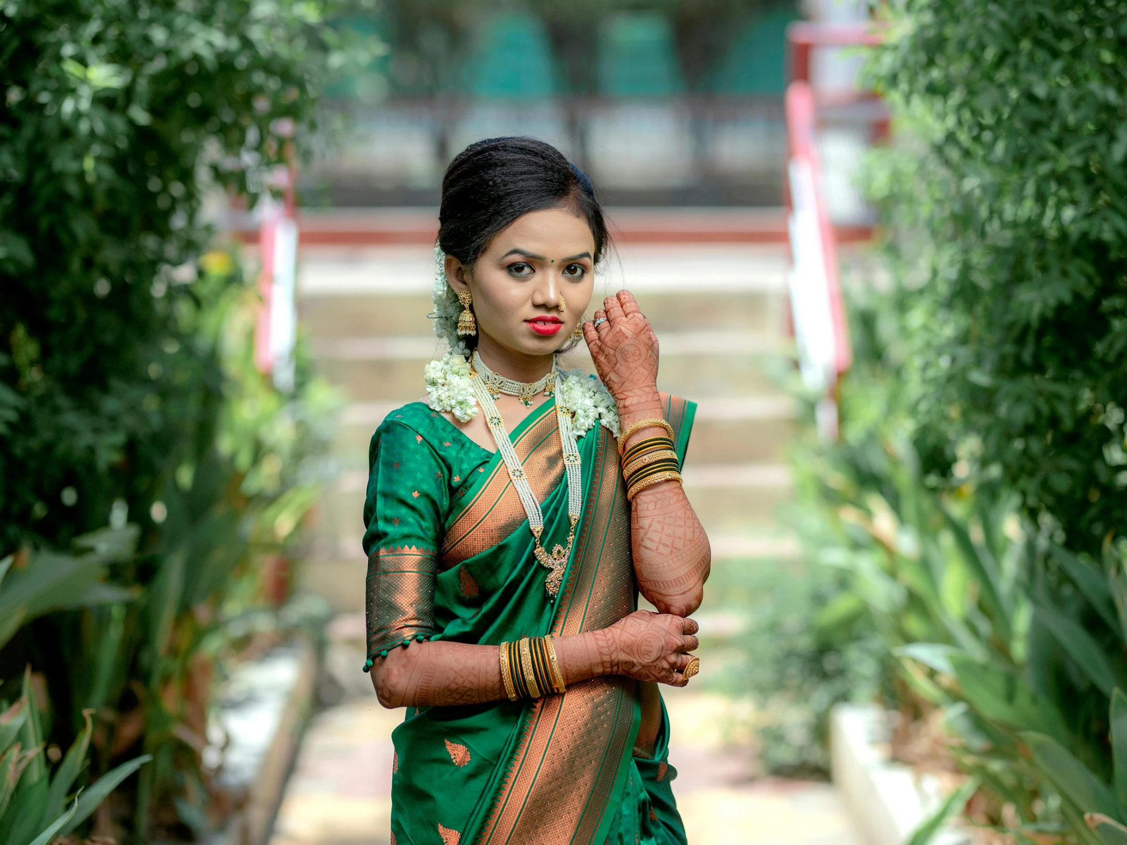 a woman in a sari holding her hands together