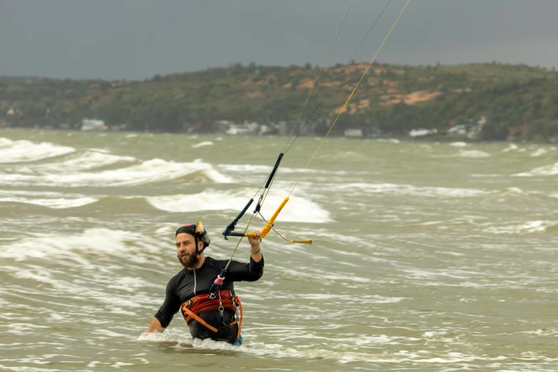 the person is trying to wake ski in the water