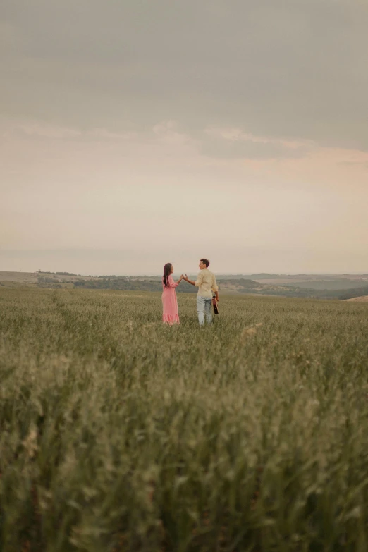 an image of two people in a field
