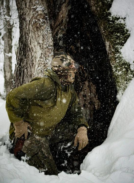 a person riding a snowboard on a snowy surface