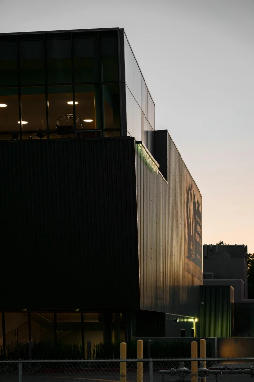 an airplane is flying over the large building