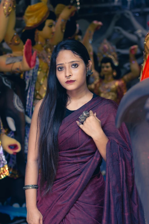 young woman dressed in traditional indian dress with long straight black hair