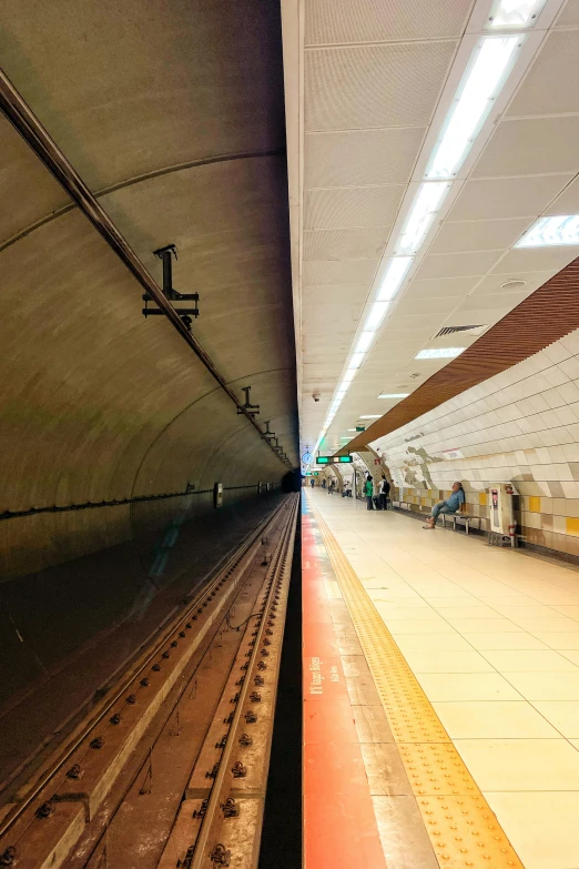 long s of empty subway in large building