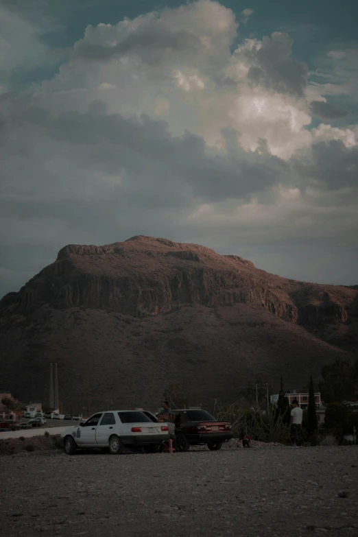 a very large mountain is in the background