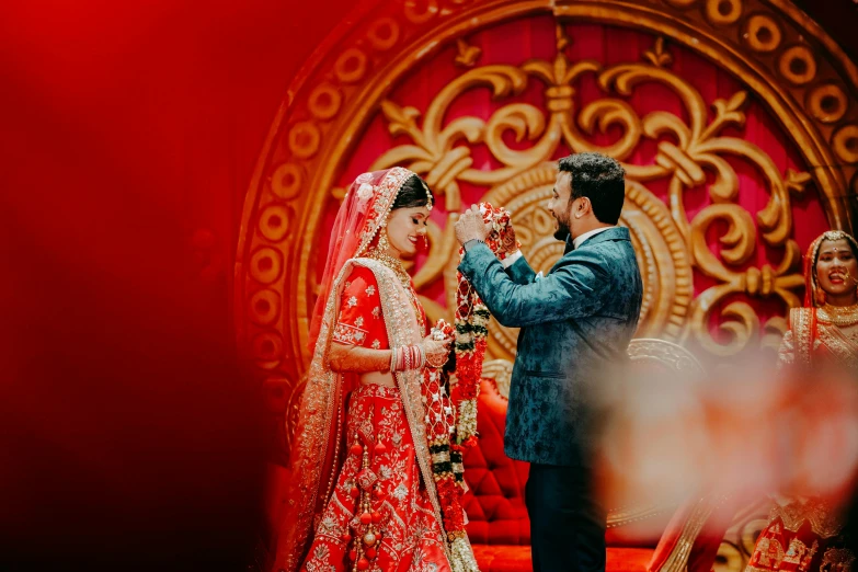 a couple getting married in a brightly lit area