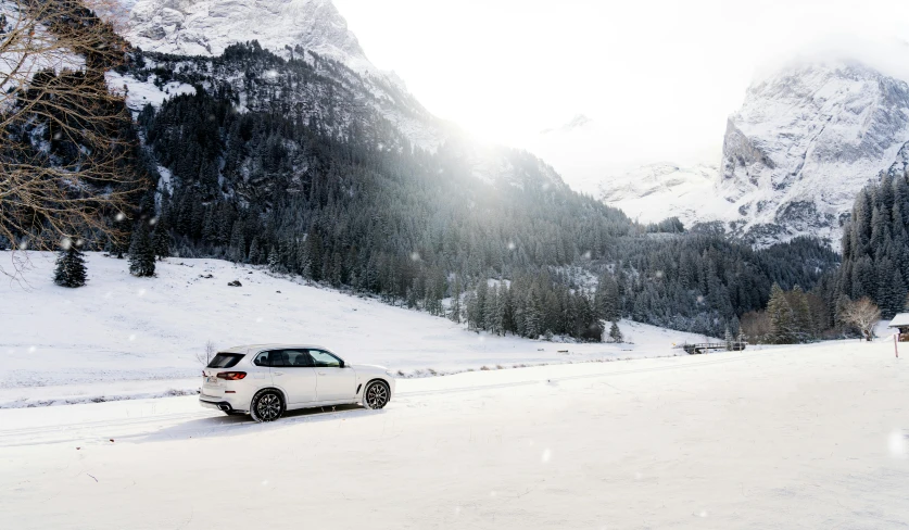 a car is driving down a snowy road