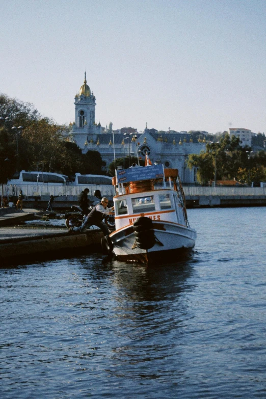 two people are on the deck of the ship