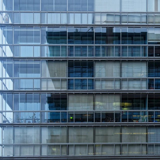 a very large modern building that appears to be very tall