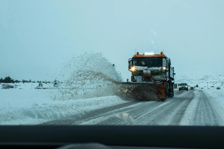 snow plows are used to clear roads during the winter