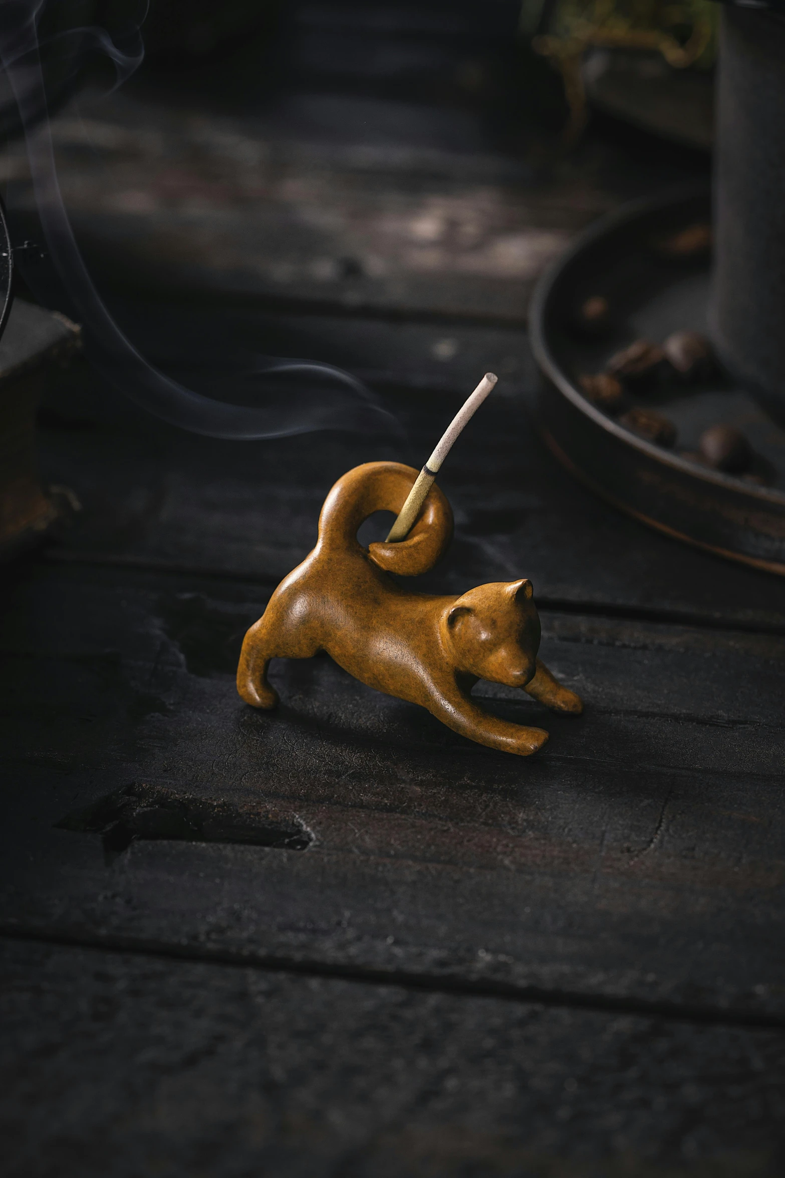 an animal smoking a hook on the ground