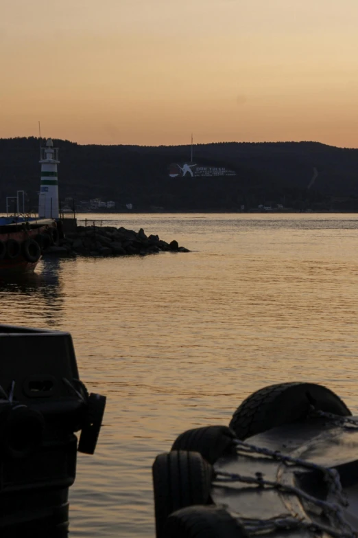 a boat sits in the distance, by the dock