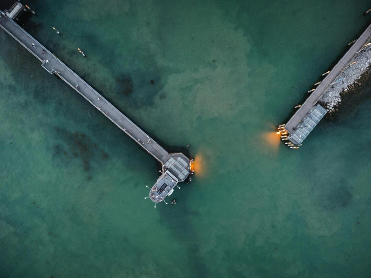 an aerial view of a two docked boats