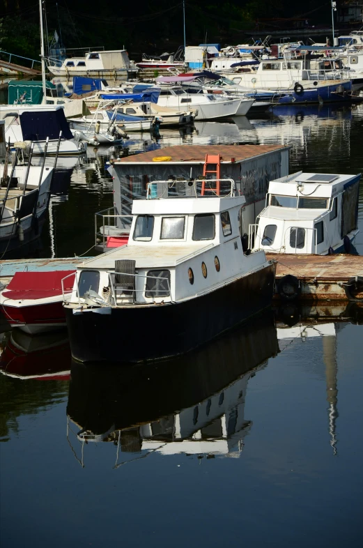 several boats docked at a dock at the shore