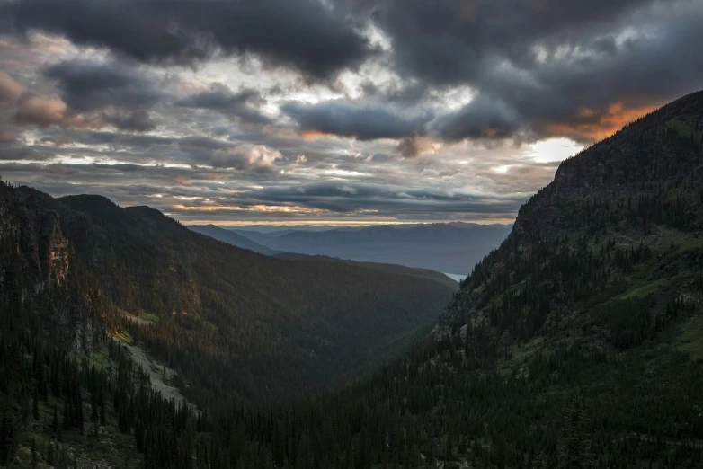 sun going down in the dark of the mountains