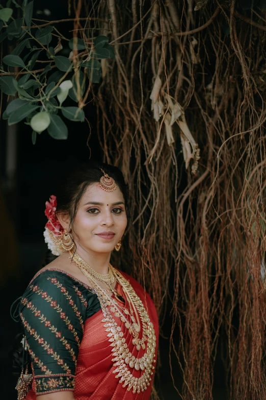 a woman in a red and black saree