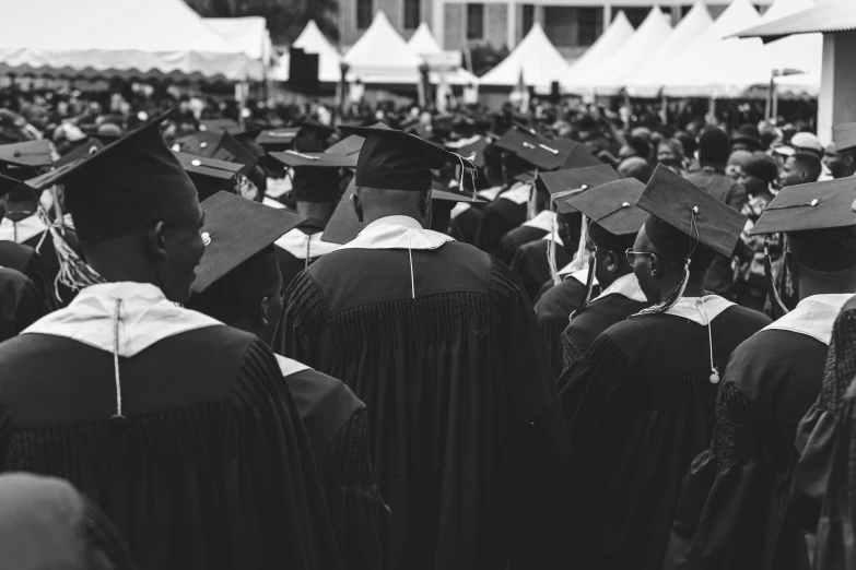 a group of graduates and spectators at the graduation