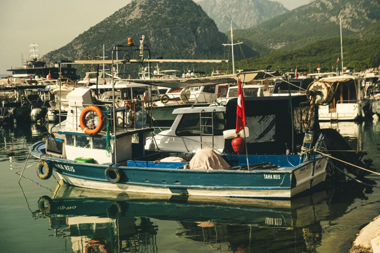 a boat is tied up next to another one