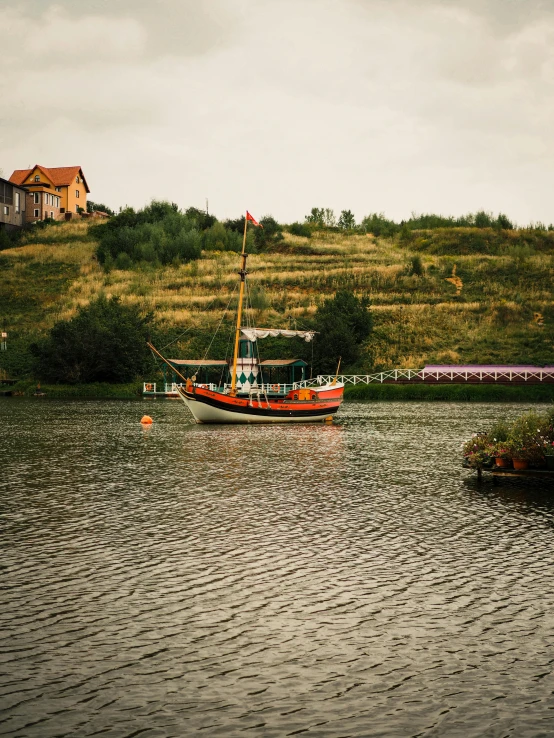 a boat is sitting on a calm lake