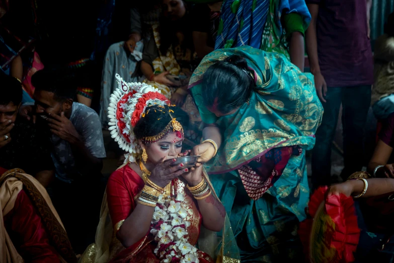 a woman that is looking at soing in her hand