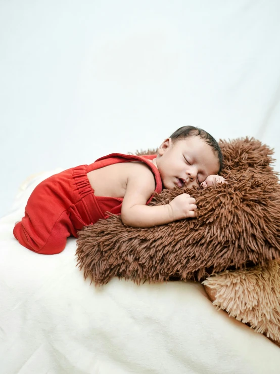 a baby is laying down on the pillow