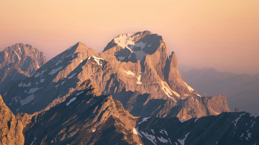 a very tall mountains with some snow on them