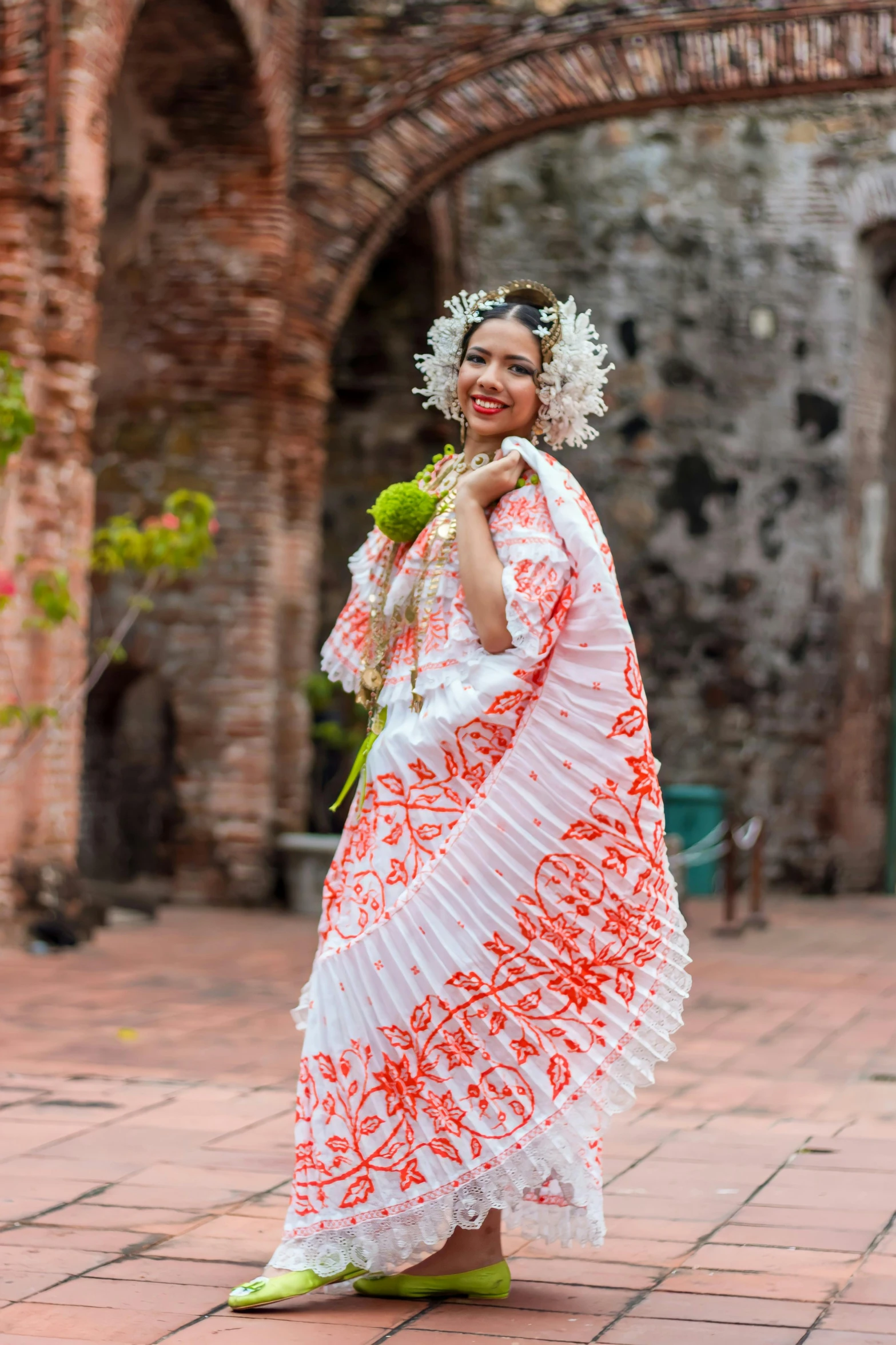 a woman dressed in an elaborate dress with a floral crown