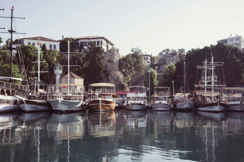 boats docked in the water and city buildings visible