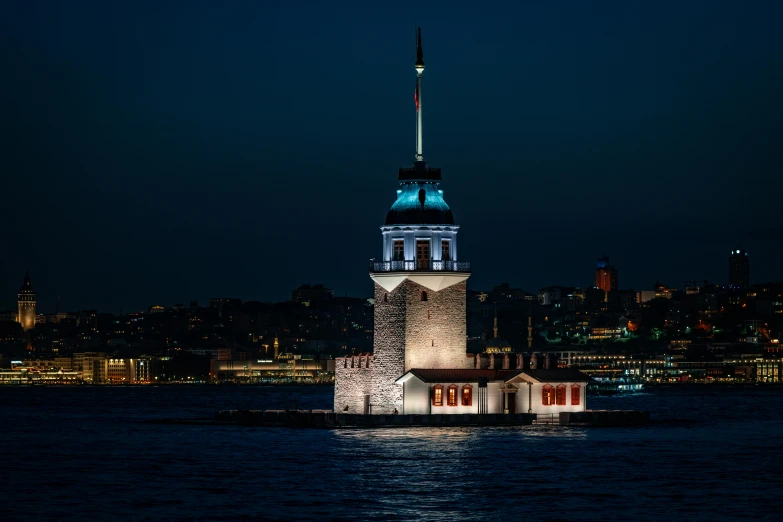 an image of a night scene with the moon and a clock tower