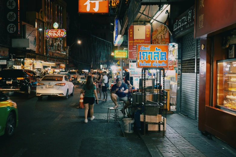 people walking in the streets of an asian city