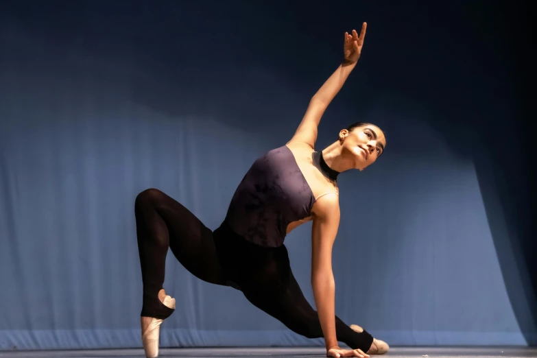 an image of woman doing yoga in the middle of the room