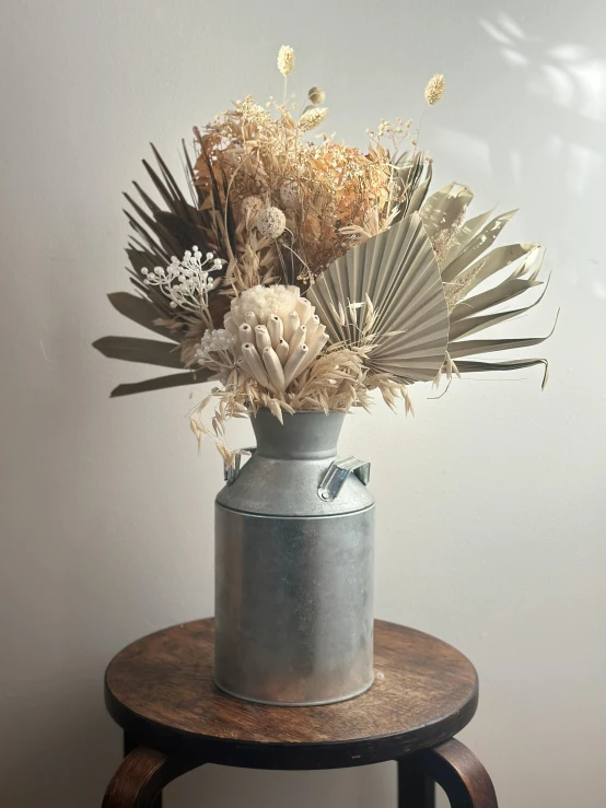 an iron pot with a bunch of wild flowers in it