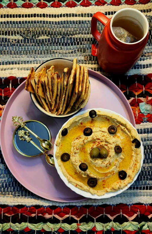 a close up ofa plate with food on it and cups