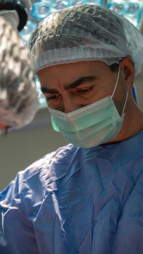 two doctors wearing masks looking at soing