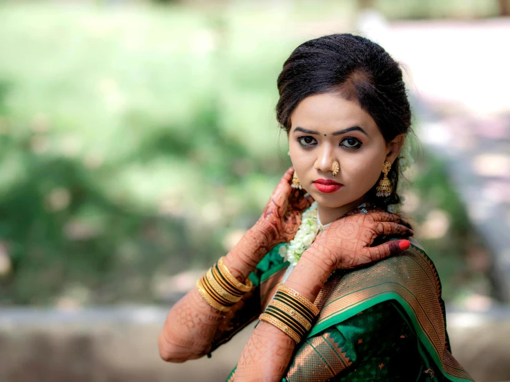 a woman in traditional dress with jewelry on her neck