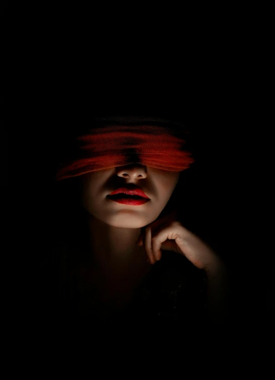 a woman's face lit up with red light