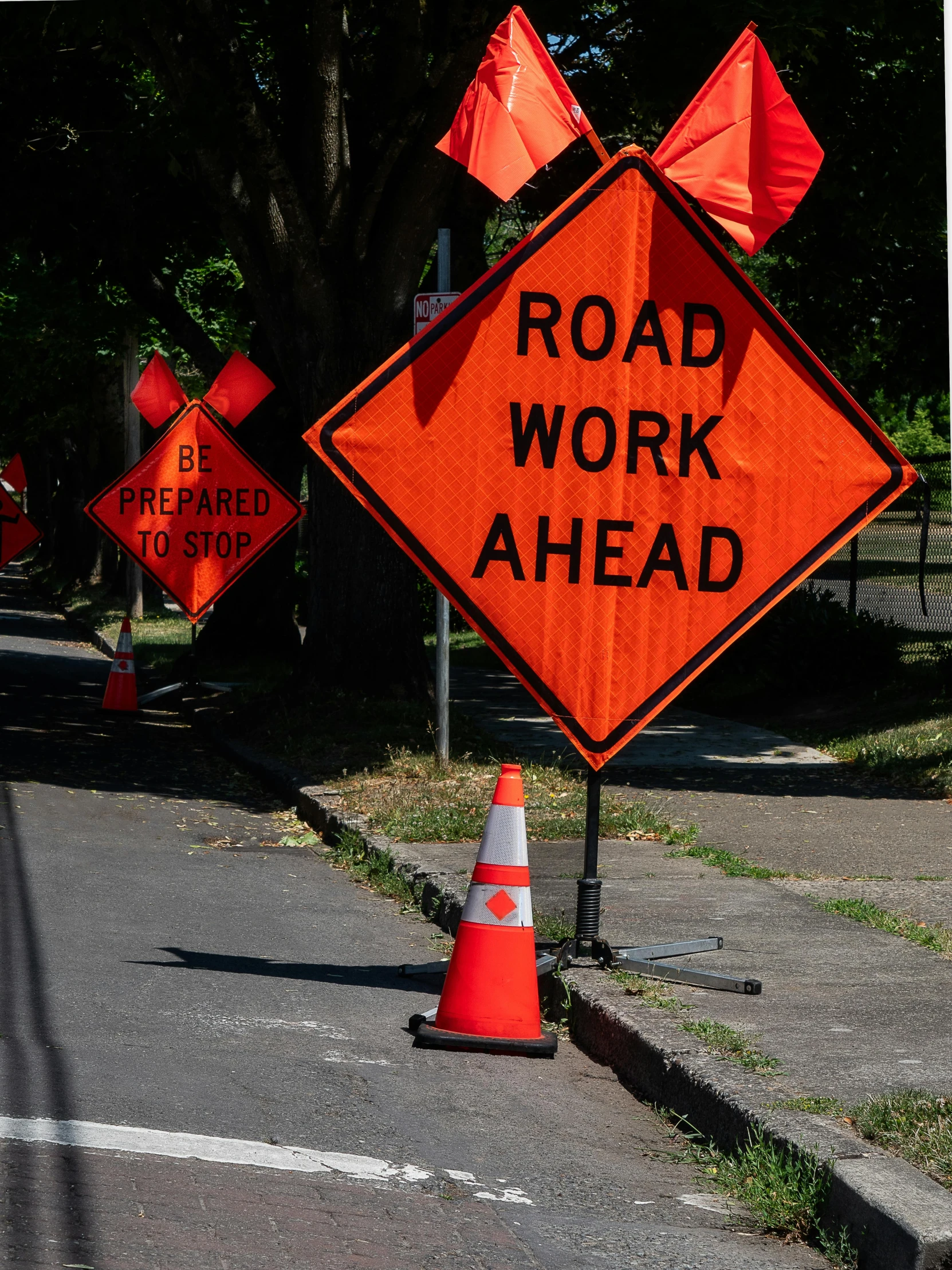 a street sign is painted on a construction work ahead sign