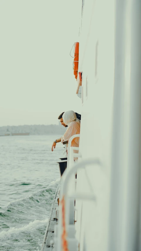 two people on a boat in the ocean