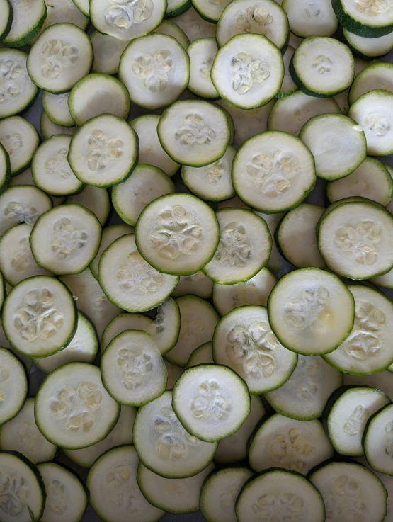 cucumbers are arranged in the same circle to make a cut up vegetable