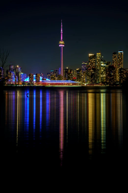 view from across the water of city at night