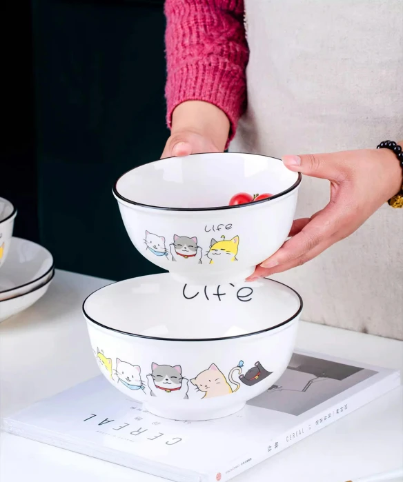 a person is dipping some soup into two bowls