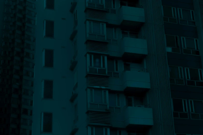 a building with windows in the night light