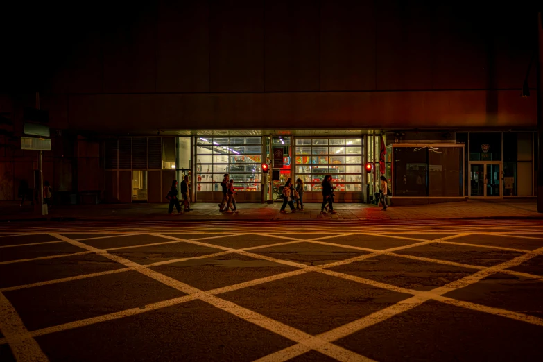 a couple of people standing at the entrance to a building